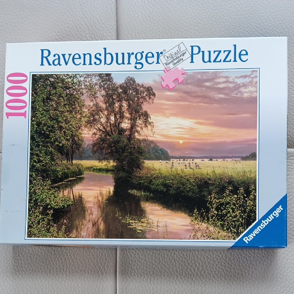 1,000 piece Ravensburger Puzzle with Tranquil Sunset Scene